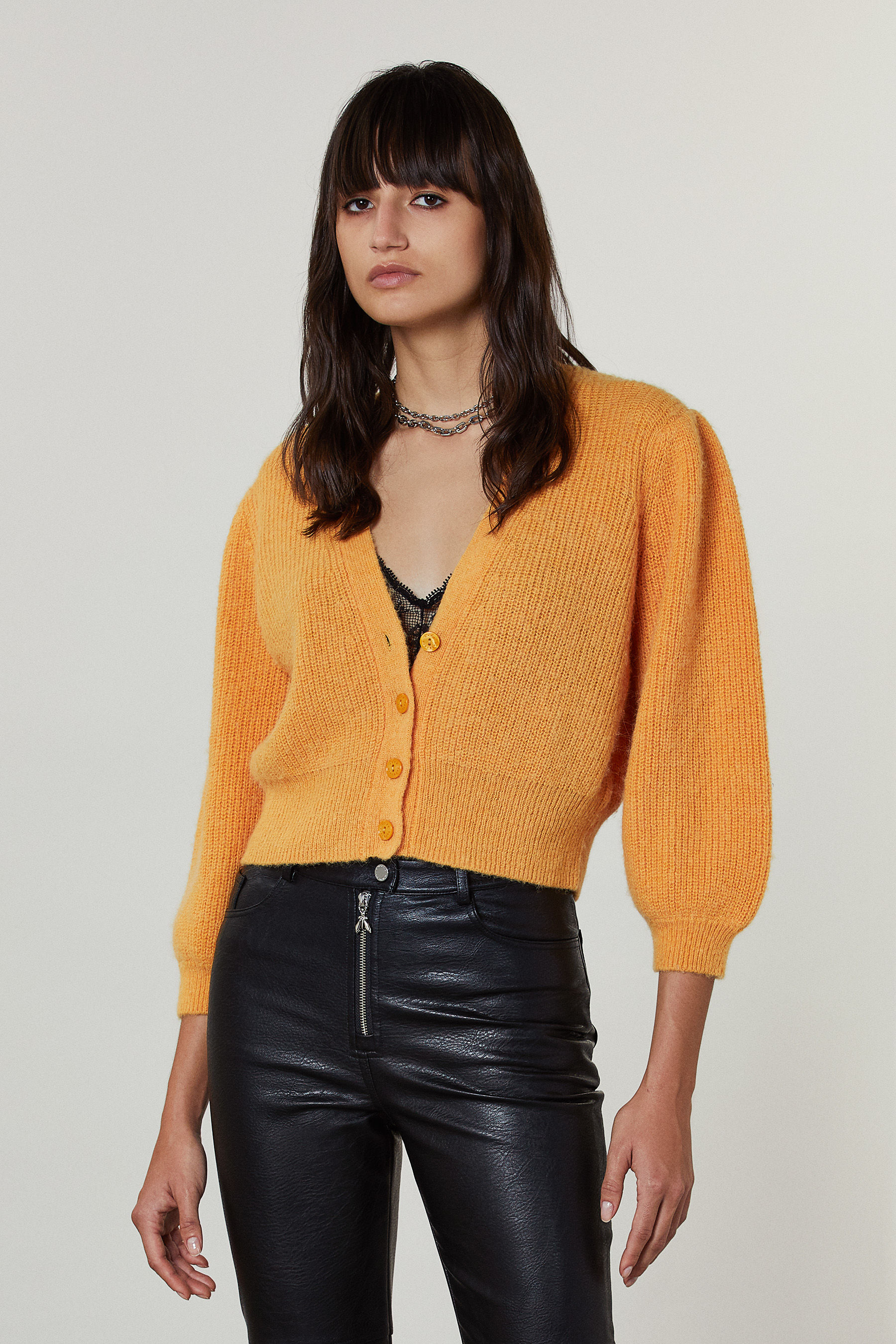 yellow button up sweater