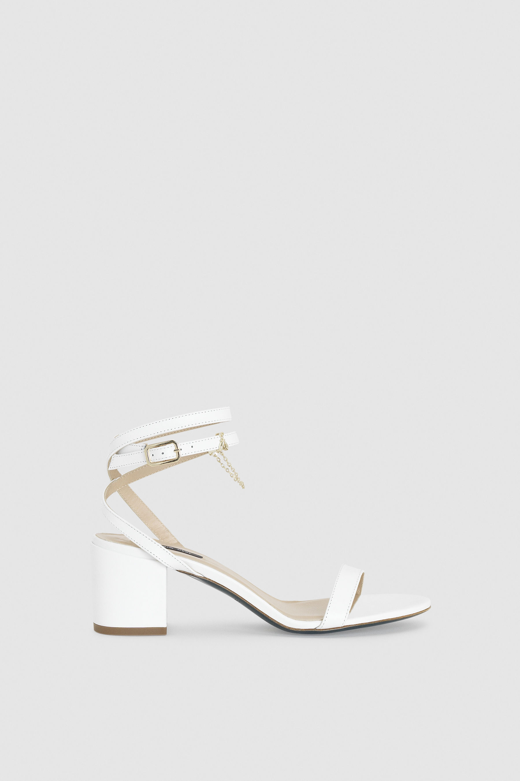 white heeled sandals