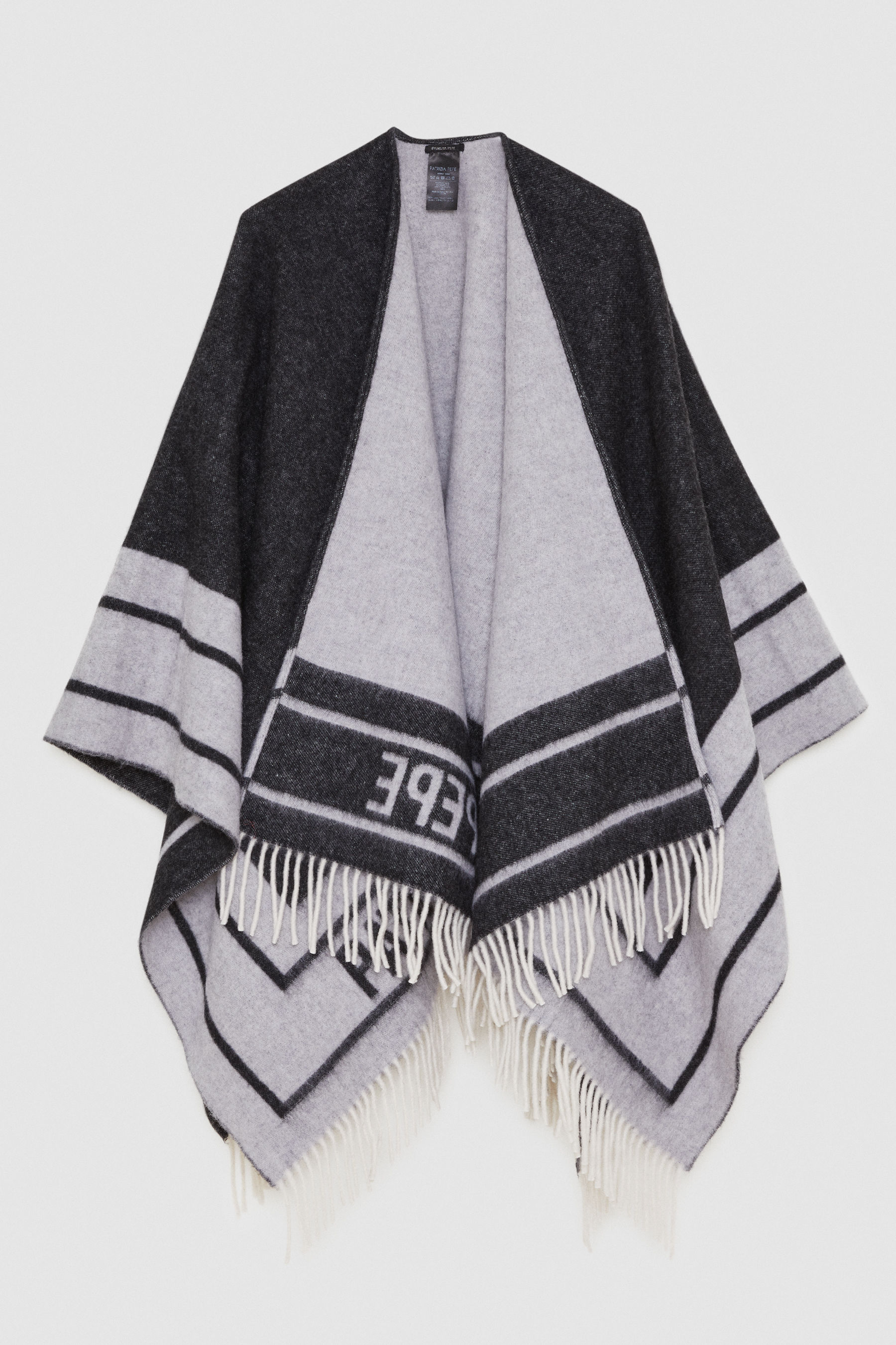 Poncho double face con frange