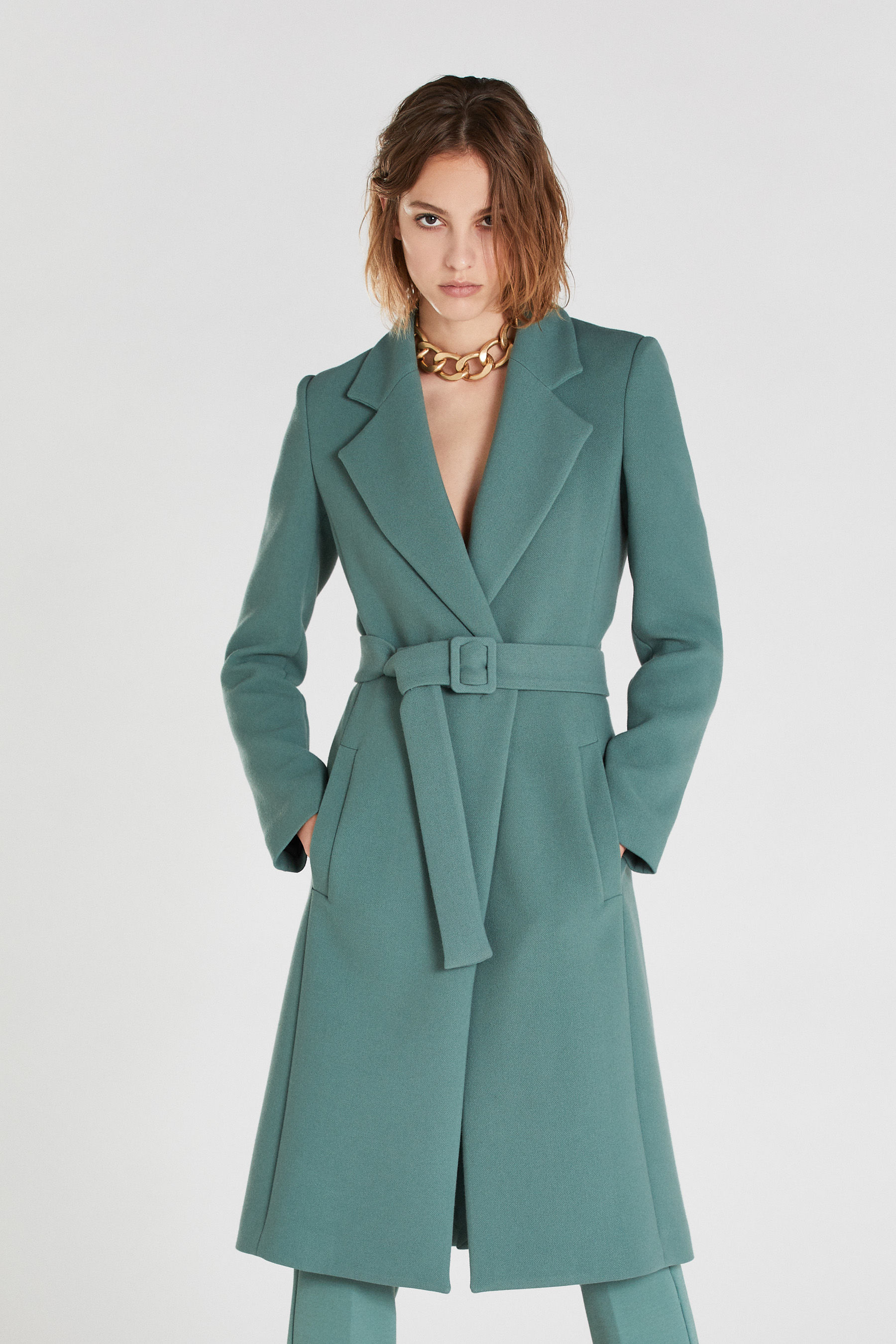 green belted coat