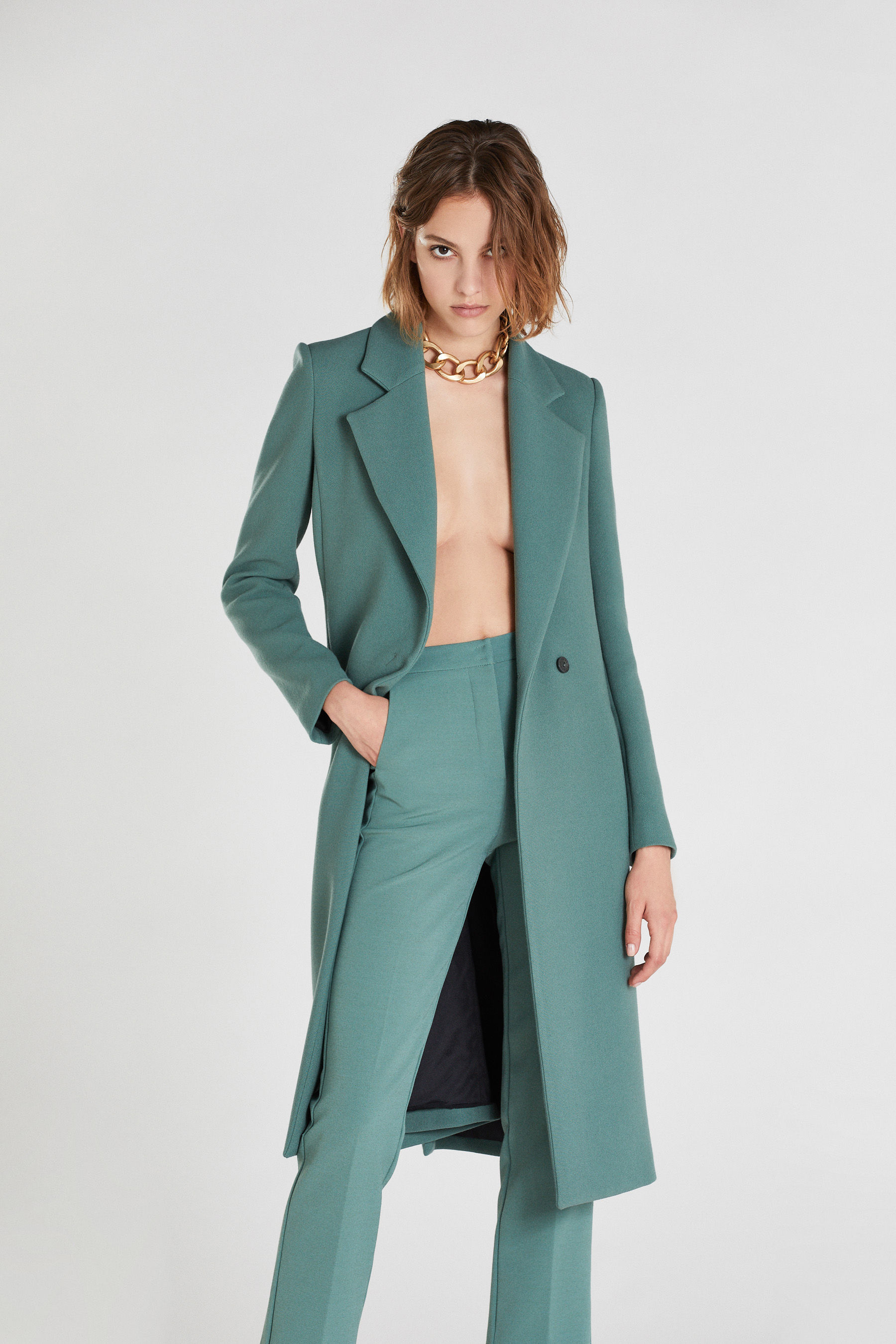 teal green coat